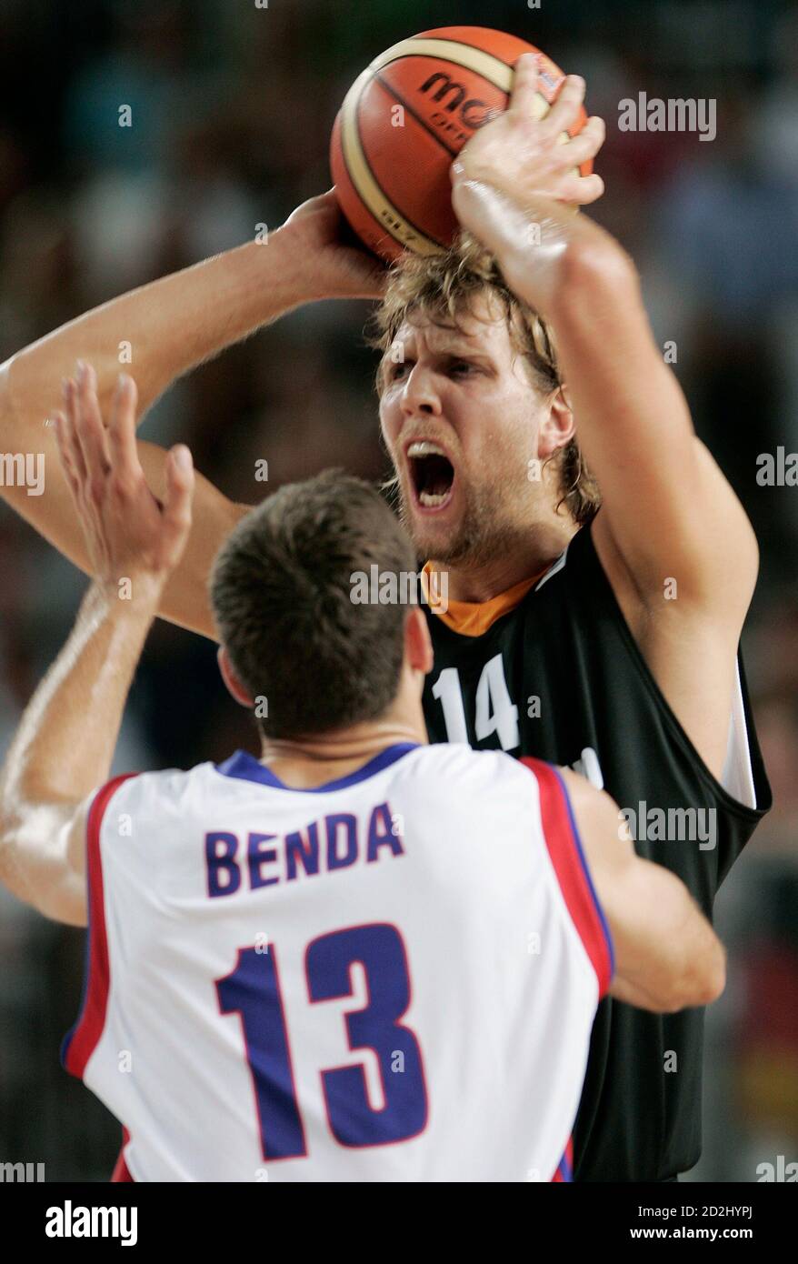 Dirk Nowitzki Of Germany Looks To Pass The Ball Past Petr Benda Of Czech Republic During Their First Round Game At The European Basketball Championships In Palma De Mallorca September 3 2007