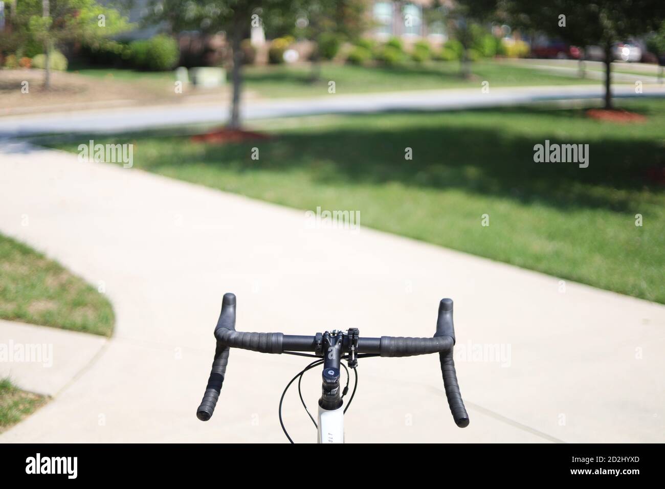 A gravel bike on a stand after a fresh wash on a sunny day with house in  background Stock Photo - Alamy
