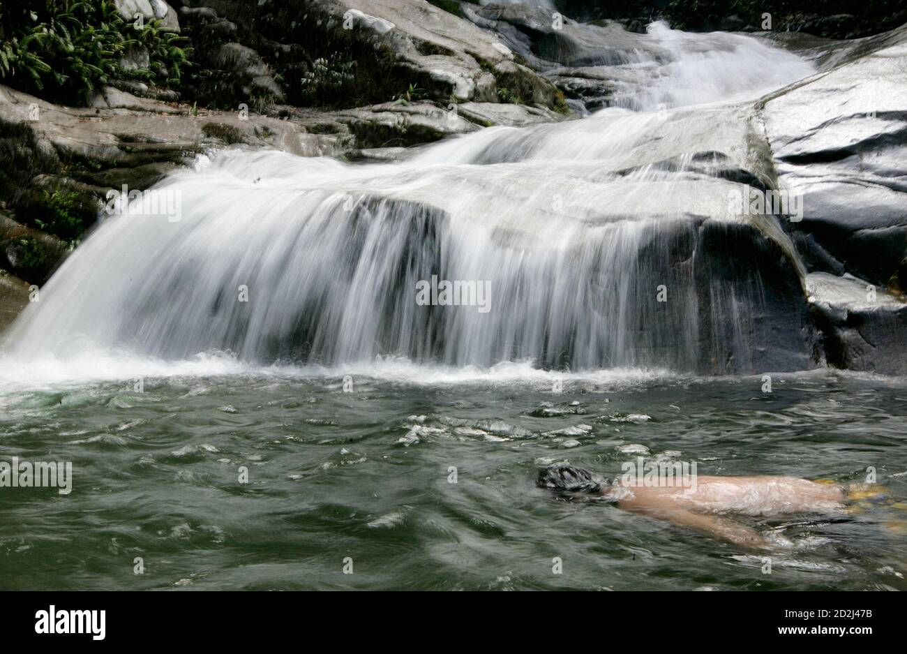 A Man Swims At Lopo Waterfall In Hulu Langat Near Kuala Lumpur January 27 2009 Reuters Zainal Abd Halim Malaysia Stock Photo Alamy