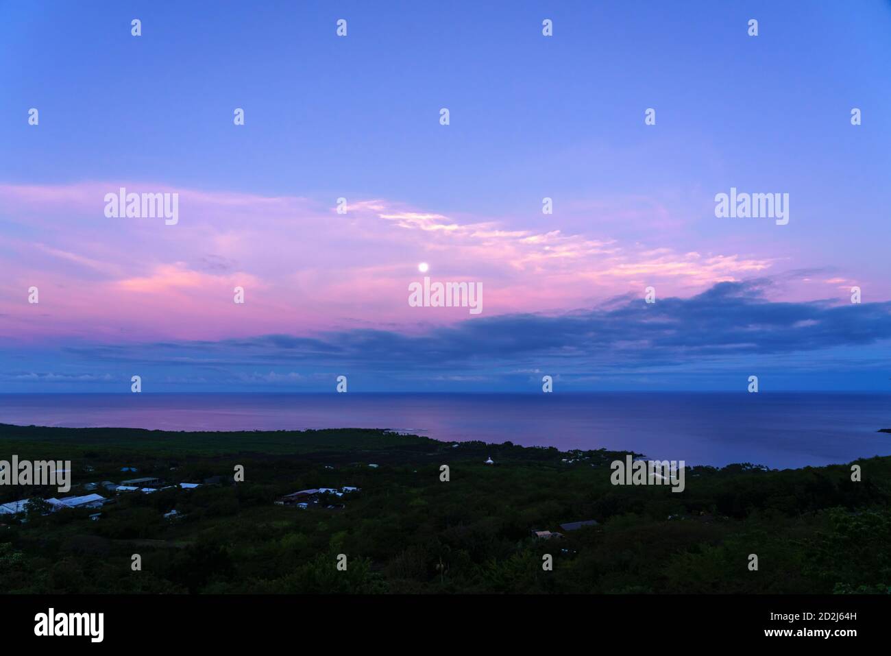 Dawn moonset over South Kona Coast including Kealakekua Bay and Keei area of Hawaii Island. Stock Photo