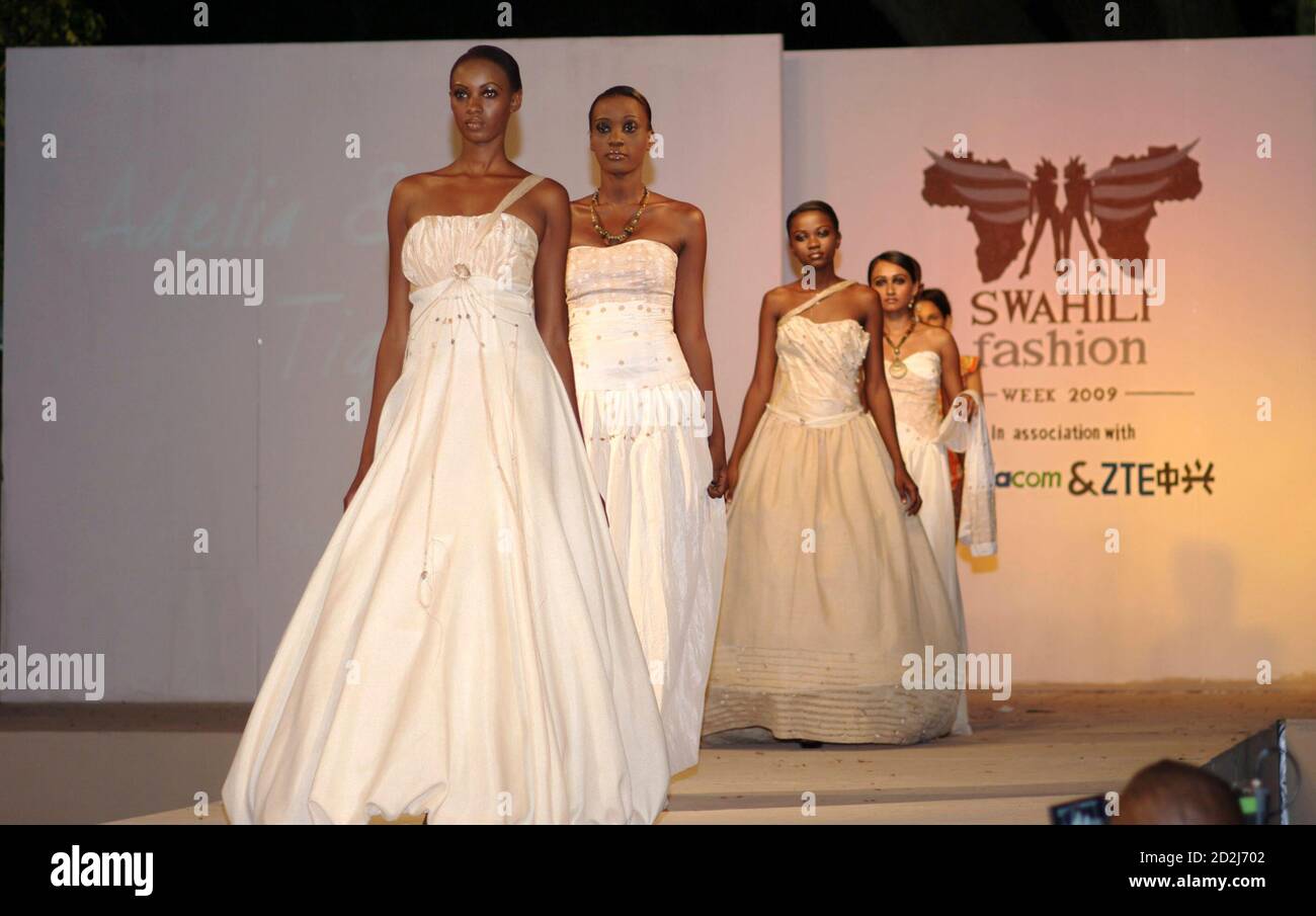 Models present white wedding dresses at Swahili Fashion Week in Tanzania's  capital Dar es Salaam, November 5, 2009. For women in Tanzania's humid Dar  es Salaam port city, the \