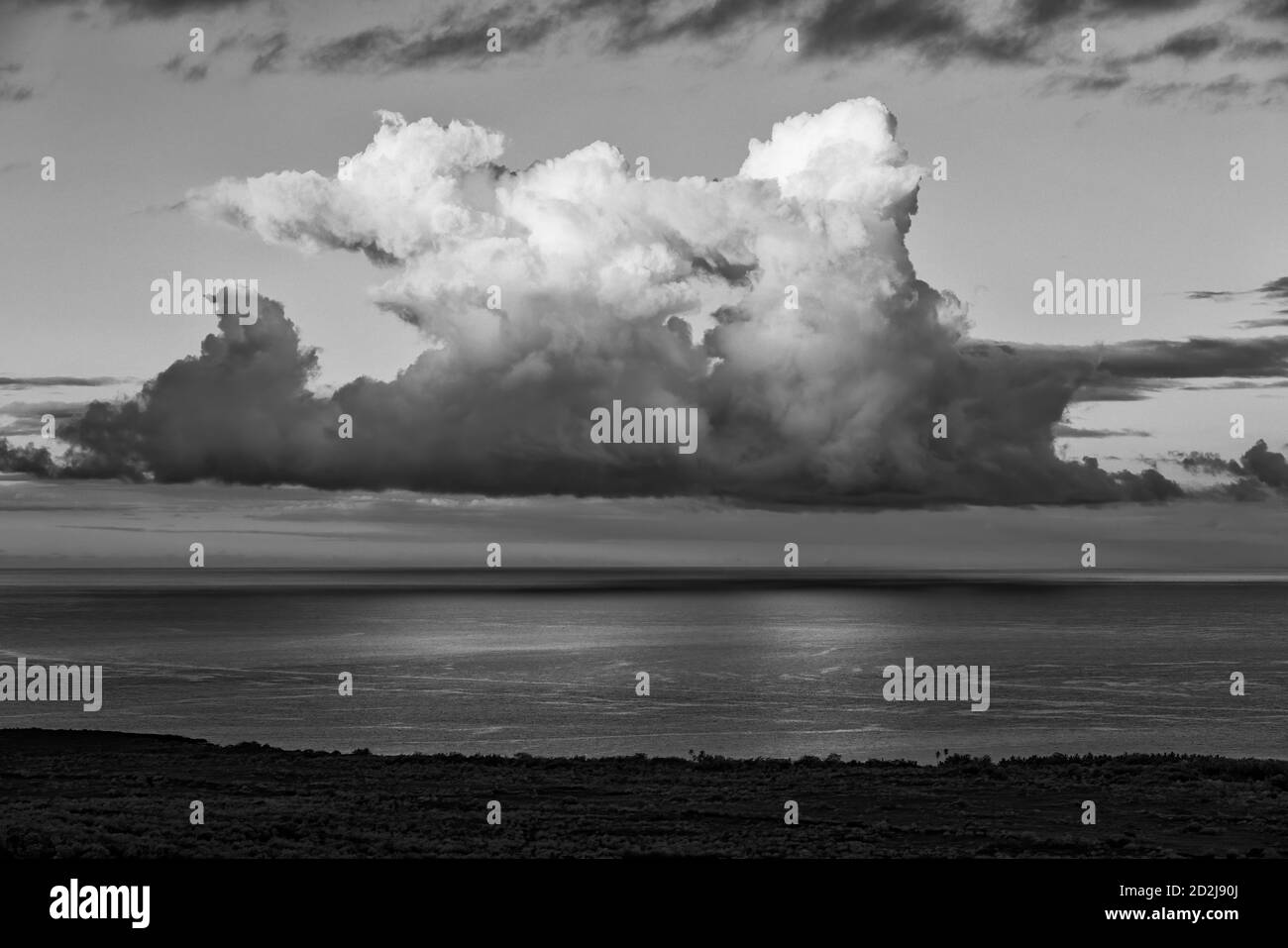Black & white of early morning cumulus clouds over South Kona Coast of Hawaii Island, including Keei area. Stock Photo