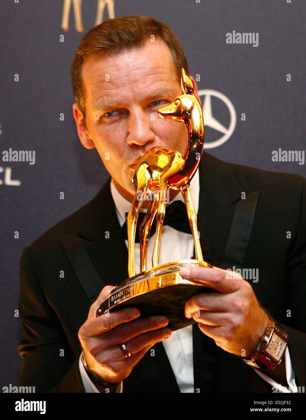 German boxer Henry Maske kisses his Bambi award during the 59th Bambi media  awards ceremony in the western German town of Duesseldorf November 29,  2007. Each year, the German media company 'Hubert