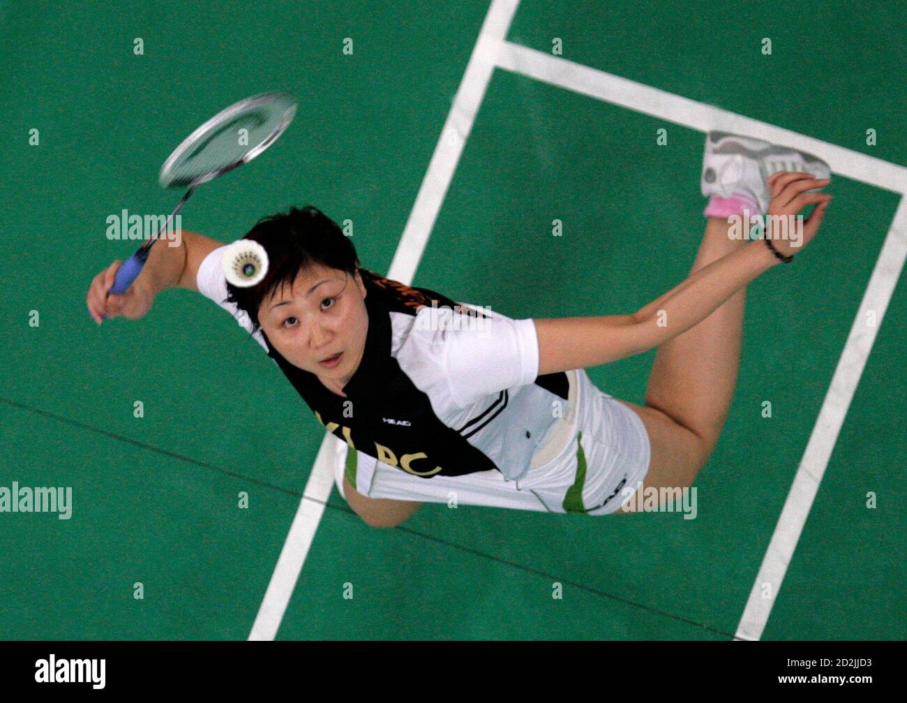 Hong Kong's Zhou Mi returns a shot to Pi Hongyan of France during the  women's singles semi-final match of the Malaysian Open badminton tournament  in Kuala Lumpur January 10, 2009. REUTERS/Zainal Abd