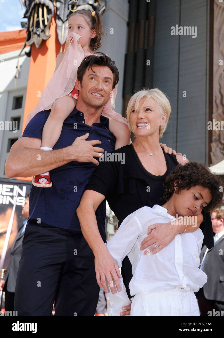 Hugh Jackman (2nd left) poses for photographers with (L-R) daughter Ava,  wife Deborra-Lee Furness and son Oscar during a ceremony where the actor  places his hand and foot prints in cement in