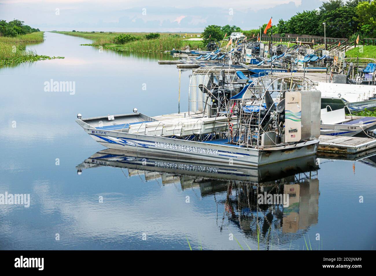 Weston Florida,Fort Ft. Lauderdale,Sawgrass Recreation Park,Everglades canal,airboats parked docked unused,tourism industry shut down,Covid-19 coronav Stock Photo