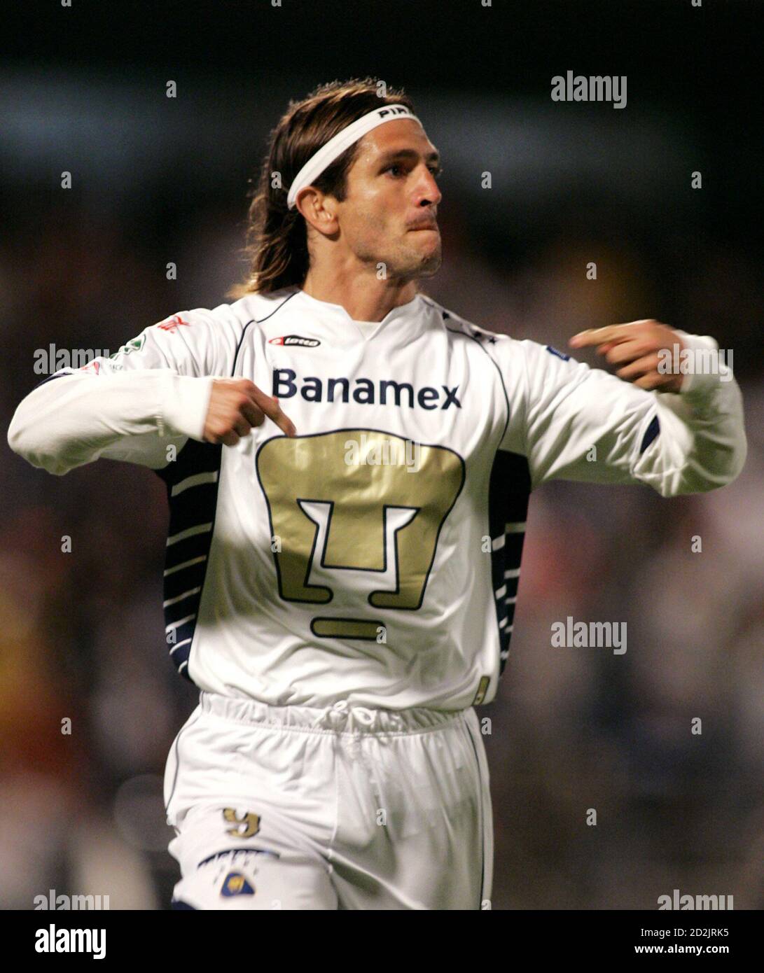 Pumas' Bruno Marioni celebrates after scoring a goal against Corinthians in  the second half of their Copa Sudamericana quarter-final soccer match in  University Stadium in Mexico City November 9, 2005. REUTERS/Daniel Aguilar