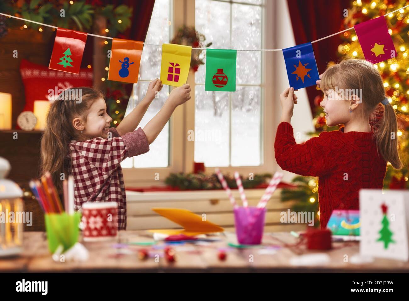 Merry Christmas and Happy Holidays. Adorable little children make cards ...
