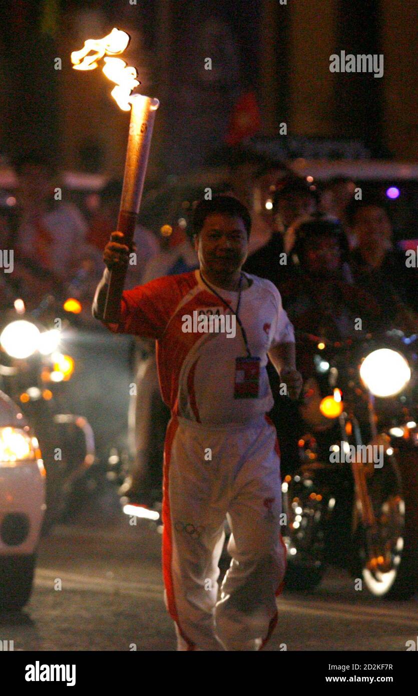 A Vietnamese torch bearer carries the torch during the 2008 Beijing