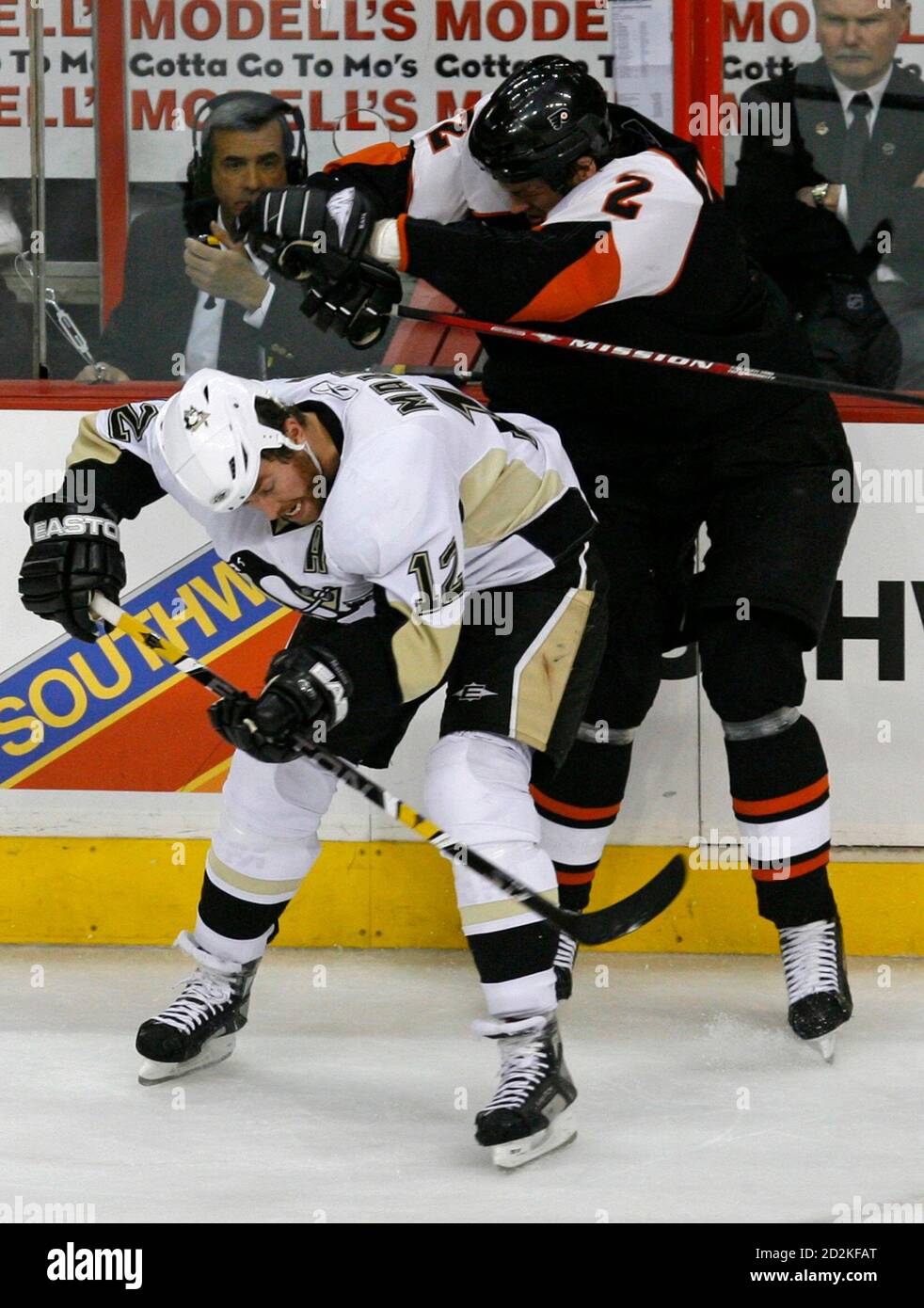 Pittsburgh Penguins Ryan Malone L Is Cross Checked By Philadelphia Flyers Derian Hatcher During The Second Period In Game 3 Of Their Nhl Eastern Conference Final Hockey Series In Philadelphia Pennsylvania May