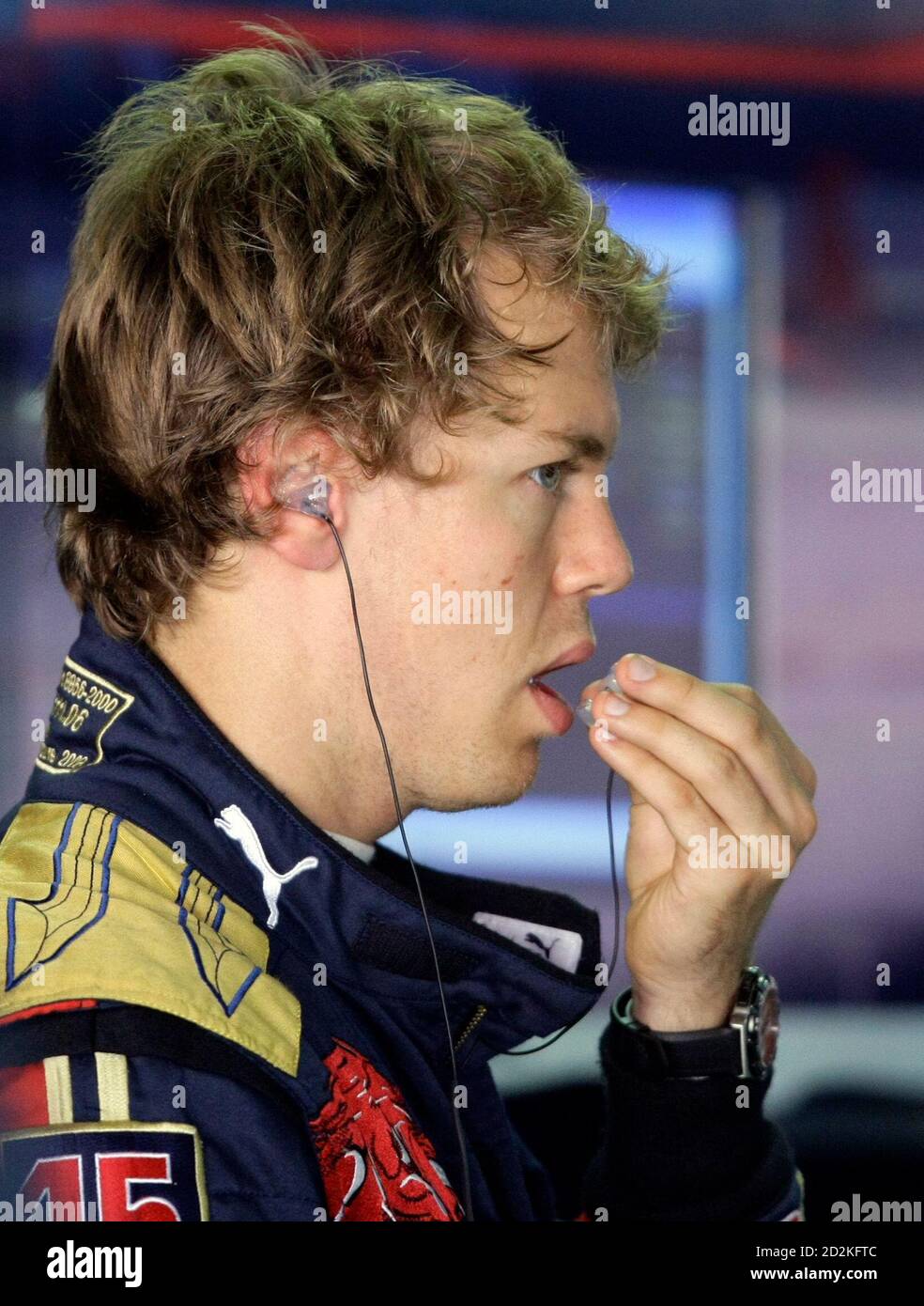 Toro Rosso Formula One driver Sebastian Vettel of Germany puts in his ear  plugs while in the pit during a three-day test drive at the Hockenheim race  track July 10, 2008. REUTERS/Alex