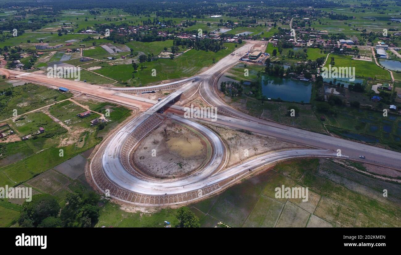 Vientiane. 6th July, 2020. Aerial photo taken on July 6, 2020 shows China-Laos expressway under construction in Vientiane, Laos. Laos is the only landlocked country in Southeast Asia. In the central part of the country, the capital Vientiane is located on the alluvial plain on the Mekong River, suitable for fishing and plantation. The Lan Xang Kingdom, the first unified multi-ethnic nation in the history of Laos, moved its capital to Vientiane in the mid-16th century, and Vientiane gradually prospered. Credit: Liu Ailun/Xinhua/Alamy Live News Stock Photo