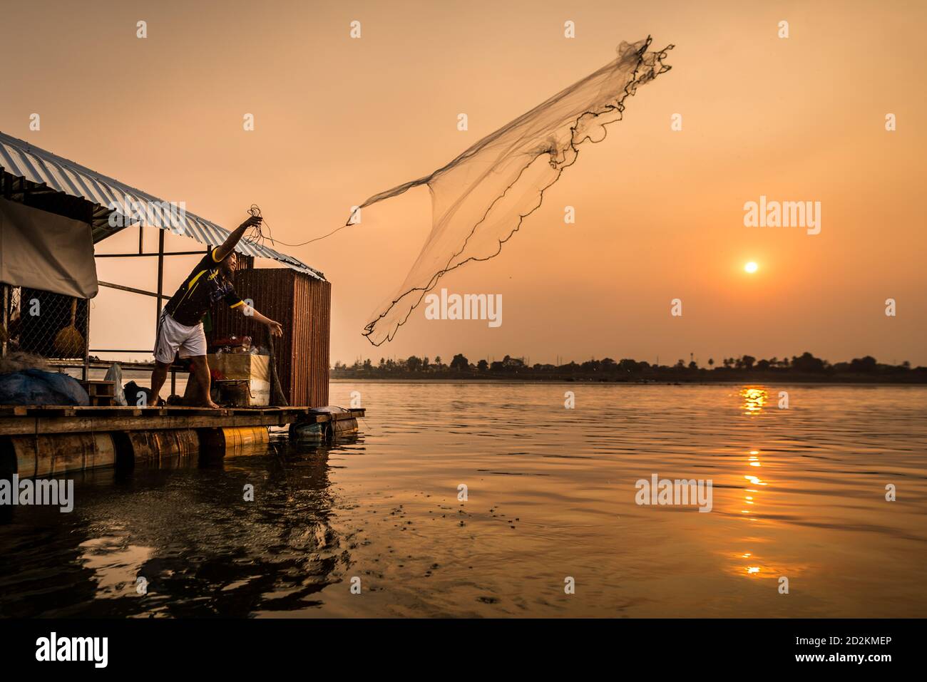 Vientiane, Laos. 10th Mar, 2020. A Lao fisherman casts his net on the Mekong River in Vientiane, Laos, on March 10, 2020. Laos is the only landlocked country in Southeast Asia. In the central part of the country, the capital Vientiane is located on the alluvial plain on the Mekong River, suitable for fishing and plantation. The Lan Xang Kingdom, the first unified multi-ethnic nation in the history of Laos, moved its capital to Vientiane in the mid-16th century, and Vientiane gradually prospered. Credit: Kaikeo Saiyasane/Xinhua/Alamy Live News Stock Photo