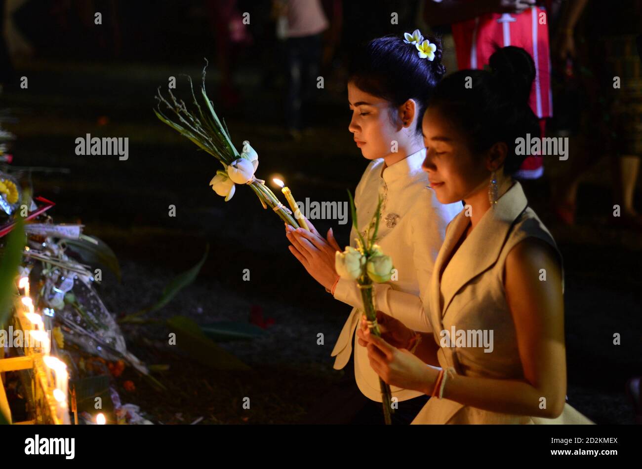 Vientiane, Laos. 3rd Nov, 2017. Two Lao girls pray before the That Luang Stupa in Vientiane, Laos, on Nov. 3, 2017. Laos is the only landlocked country in Southeast Asia. In the central part of the country, the capital Vientiane is located on the alluvial plain on the Mekong River, suitable for fishing and plantation. The Lan Xang Kingdom, the first unified multi-ethnic nation in the history of Laos, moved its capital to Vientiane in the mid-16th century, and Vientiane gradually prospered. Credit: Alan Liu/Xinhua/Alamy Live News Stock Photo
