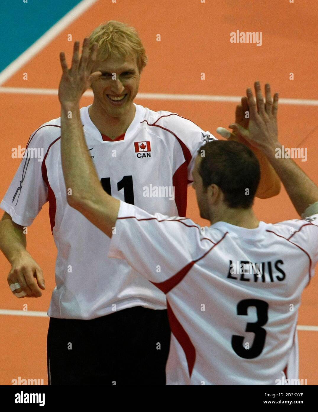 Canada's Steve Brinkman and Daniel Lewis (3) celebrate scoring against Cuba during the 2008 NORCECA Men's Continental Olympic Qualification Championship volleyball match in Caguas January 7, 2008.  REUTERS/Ana Martinez (PUERTO RICO) Stock Photo