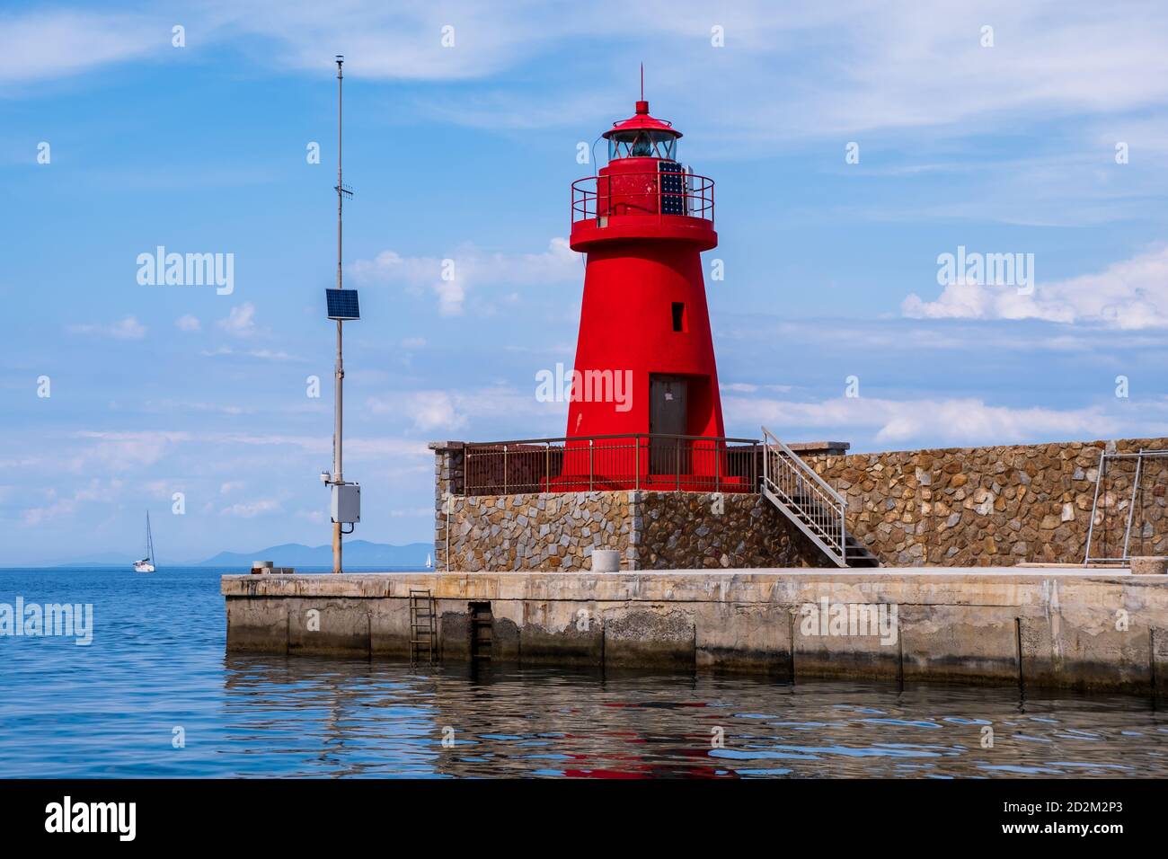 Giglio island, Grosseto, Italy view of a red lighthouse in the little