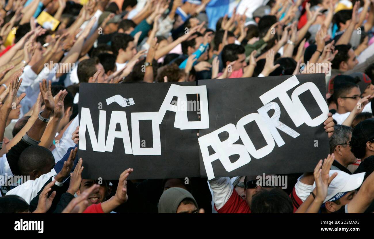 A sign that reads 'No Abortion' is held up by young Christians awaiting the arrival of Pope Benedict XVI in Pacaembu soccer stadium in Sao Paulo May 10, 2007. The Pope will be visiting Brazil through Sunday. REUTERS/Paulo Whitaker (BRAZIL) Stock Photo