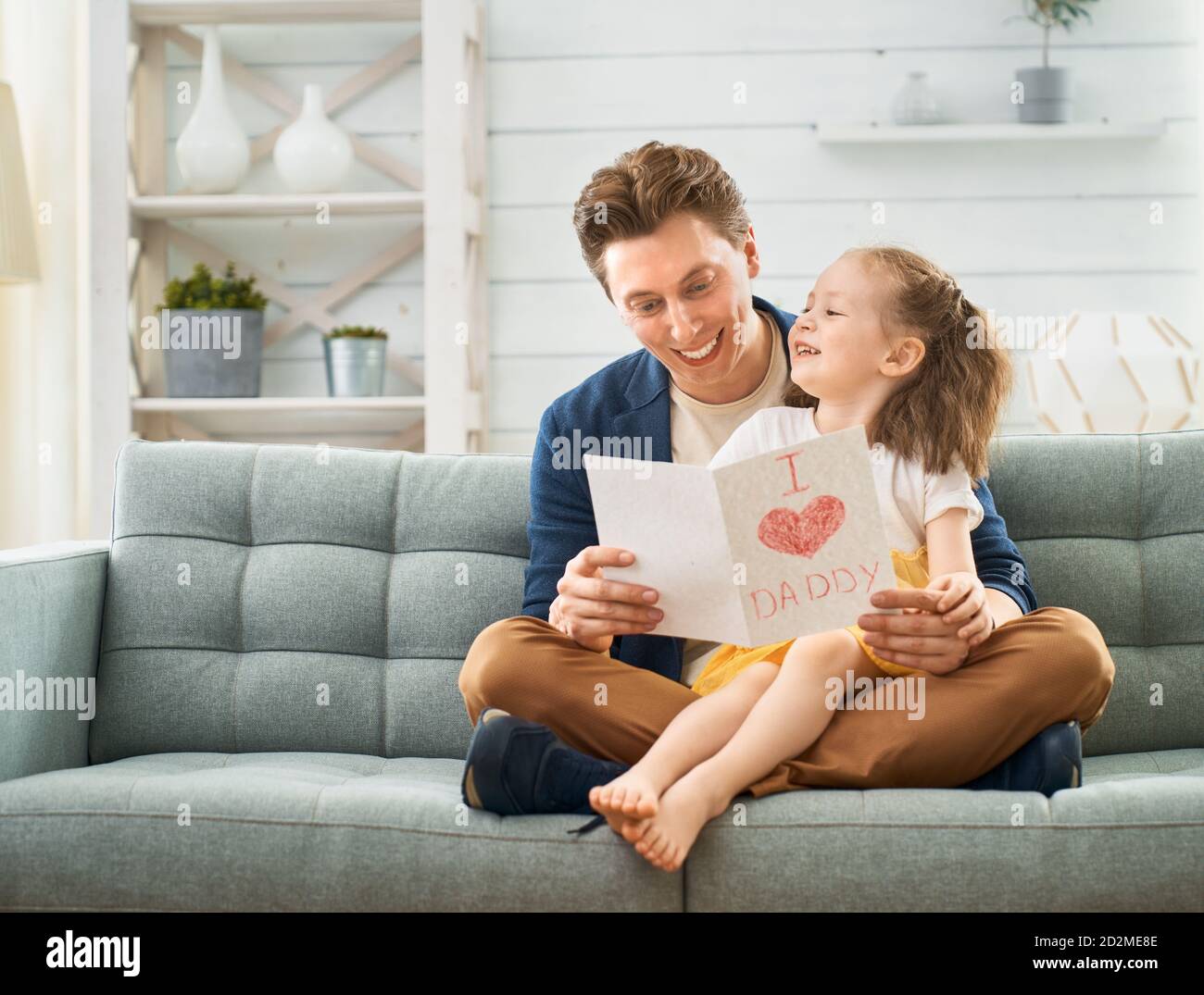 Happy father's day! Child daughter congratulating dad and giving him ...