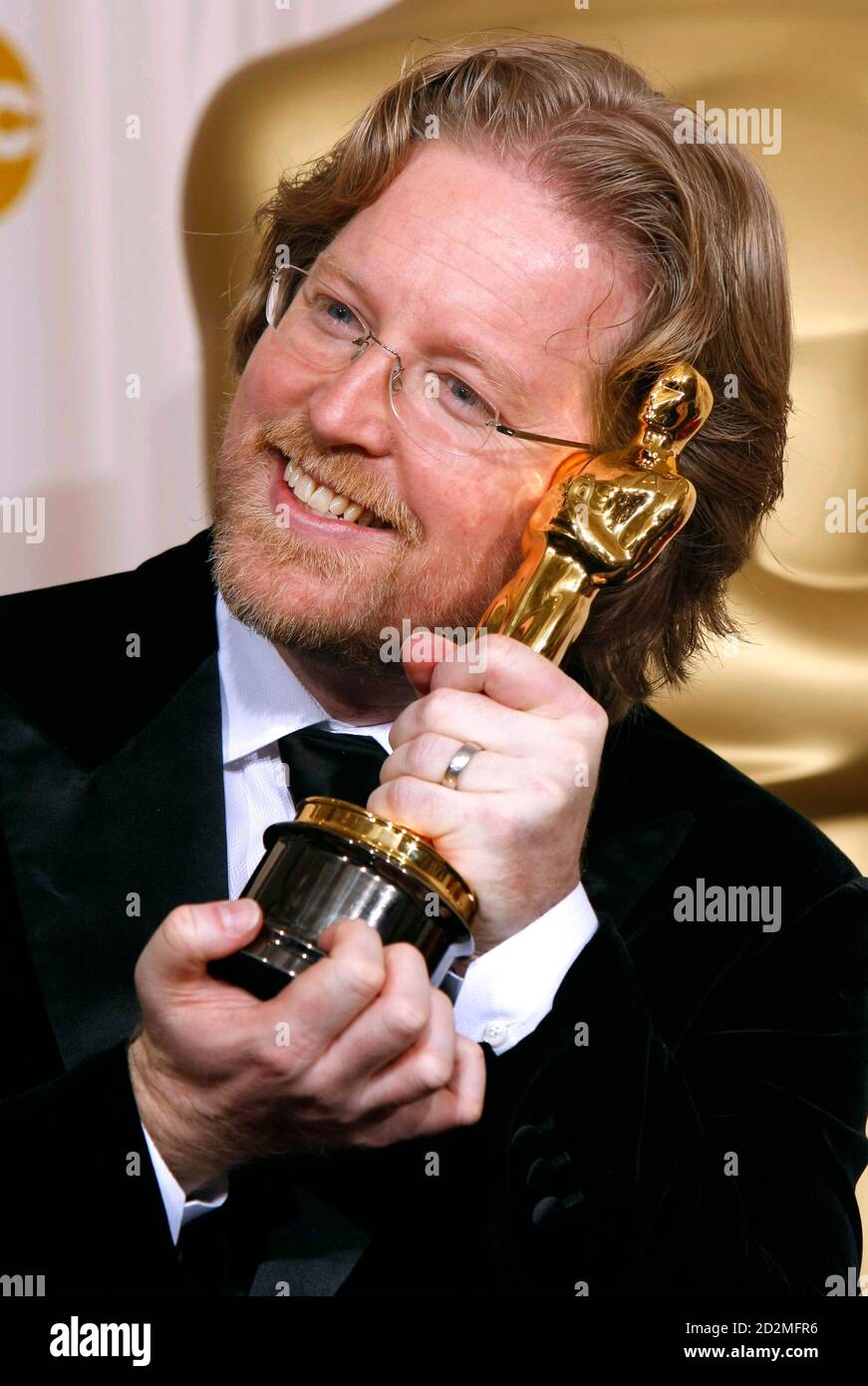Writer Andrew Stanton poses with his award for best animated feature for Writer Andrew Stanton poses with his award for best animated feature for