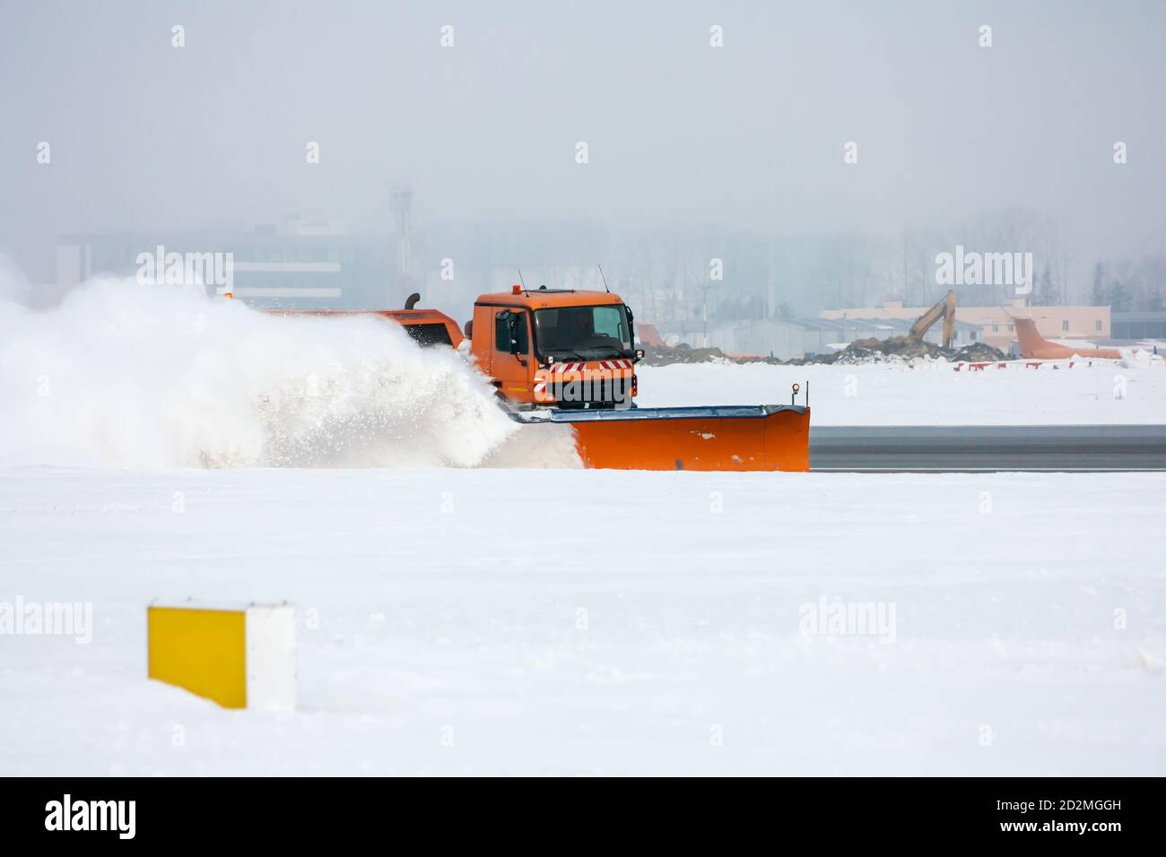 Snow-removal machine cleans the runway at the airport Stock Photo - Alamy