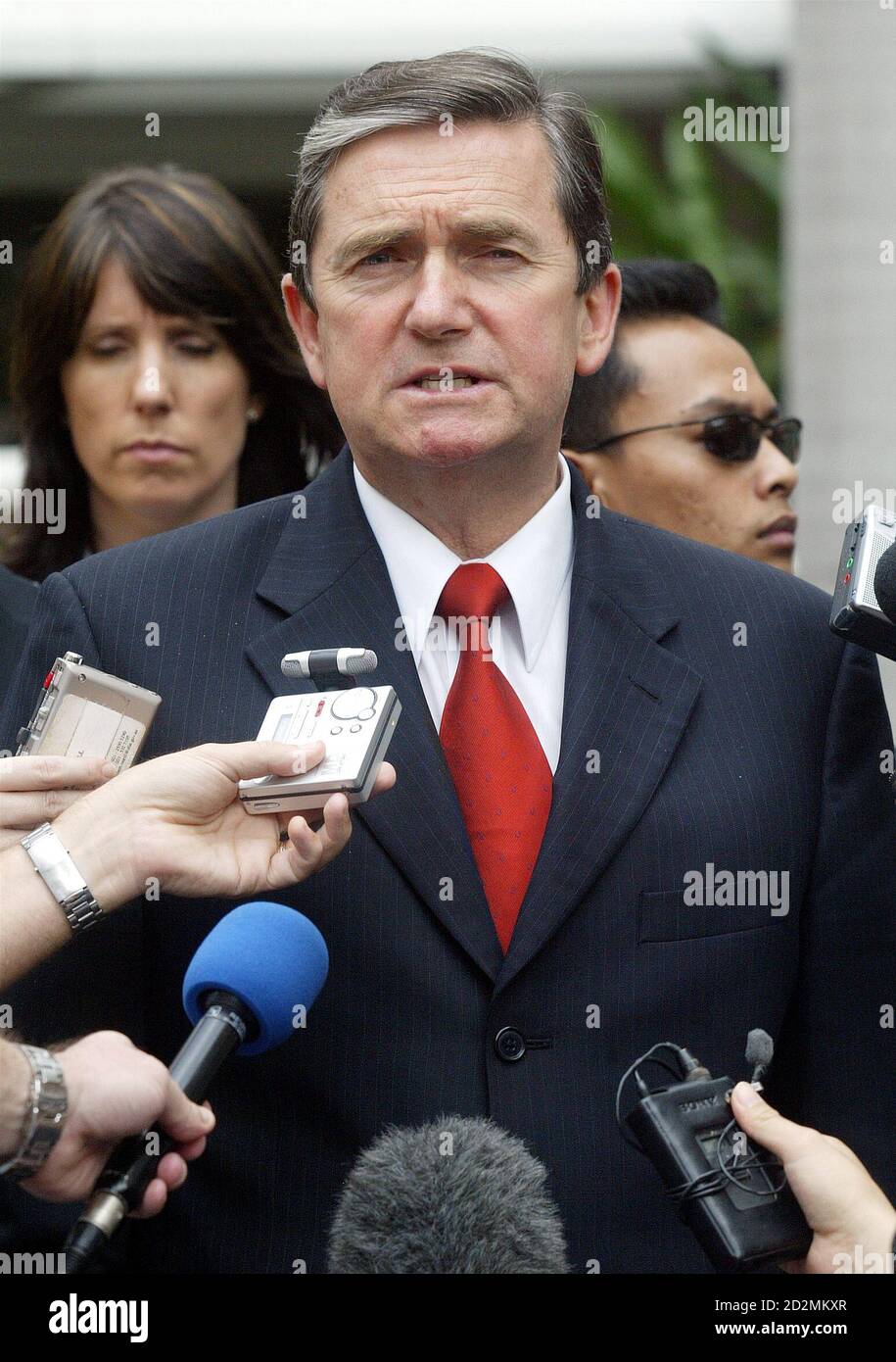 Australian Justice Minister Chris Ellison speaks to reporters after meeting Indonesian lawyer for Schapelle Corby in Jakarta.  Australian Justice Minister Chris Ellison speaks to reporters after a meeting with Indonesia's lawyer for Australian Schapelle Corby in Jakarta August 4, 2005. Ellison said the Australian government would facilitate a teleconference for witnesses in Australia if the Bali high court allows more additional hearings for Corby, who is serving a 20-year jail term for smuggling marijuana. REUTERS/Dadang Tri Stock Photo