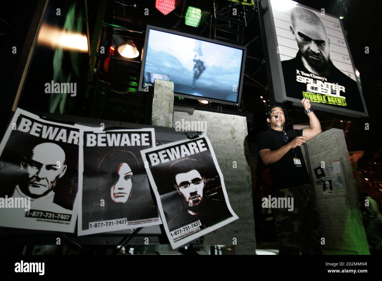 A spokesperson speaks about Tom Clancy's Splinter Cell :Double Agent  for Xbox 360 Live at the 2006 Electronic Entertainment Expo in Los Angeles May 10, 2006. REUTERS/Robert Galbraith Stock Photo
