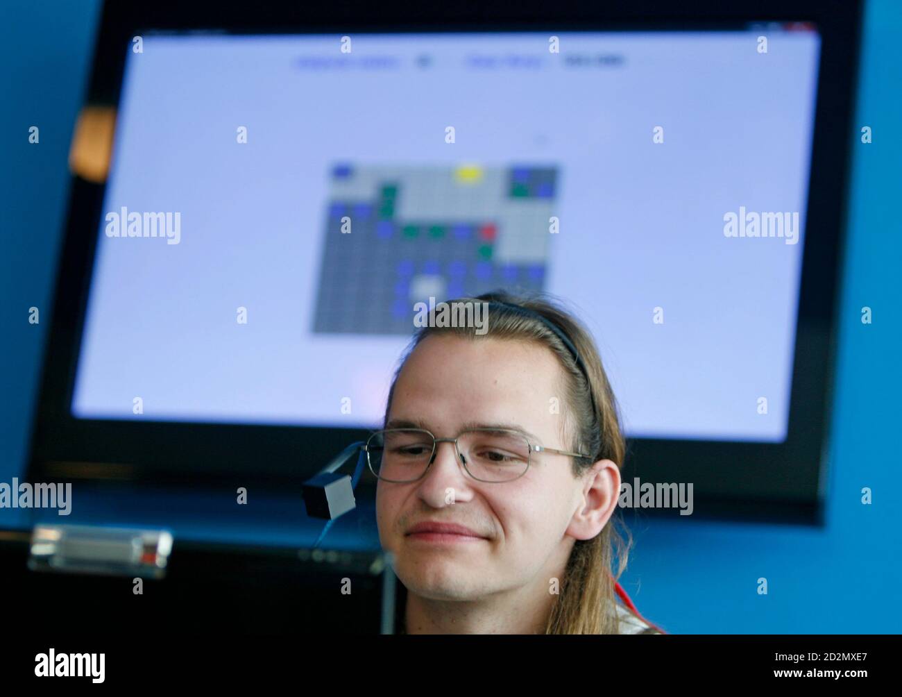 Handicapped student Michal Kabat works on his computer with a help of a  camera attached to the frames of his glasses which lets him control a  personal computer by moving his eyes