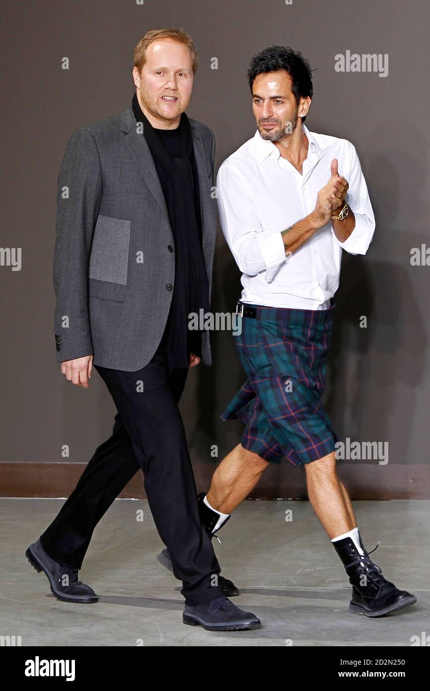 Designers Marc Jacobs (R) and Paul Helbers, for French fashion house Louis  Vuitton, appear at the end of their Fall-Winter 2010/2011 men's  ready-to-wear fashion show in Paris January 21, 2010. REUTERS/Charles  Platiau (