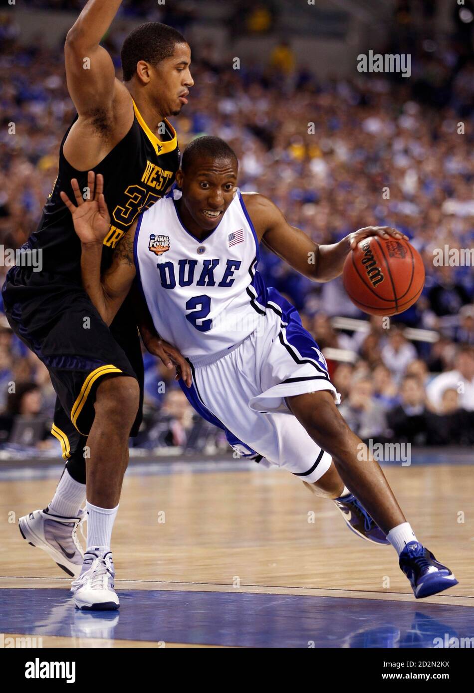 Duke's Nolan Smith (R) drives around West Virginia's Wellington Smith during their NCAA Final Four semi-final college basketball game in Indianapolis, Indiana April 3, 2010.     REUTERS/Jeff Haynes (UNITED STATES - Tags: SPORT BASKETBALL) Stock Photo