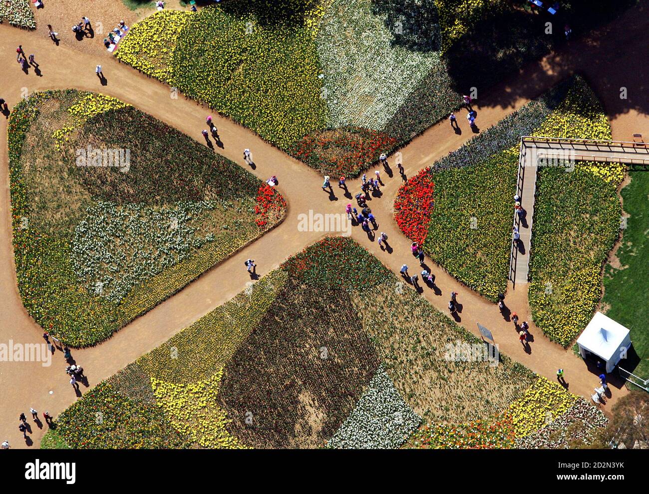 Tourists Walk On Pathways Through One Of 16 Flower Beds At The Floriade Flower Festival In Canberra September 23 05 The Flowerbeds Are Designed To Represent The Theme Rock N Roll In