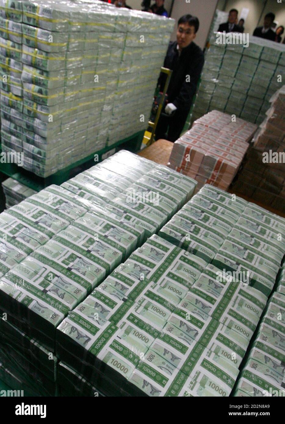 An Employee From The Bank Of Korea Moves Stacks Of Korean Won For Delivery To Commercial Banks In Seoul January 31 08 Cash Demand Usually Picks Up Ahead Of The Lunar New
