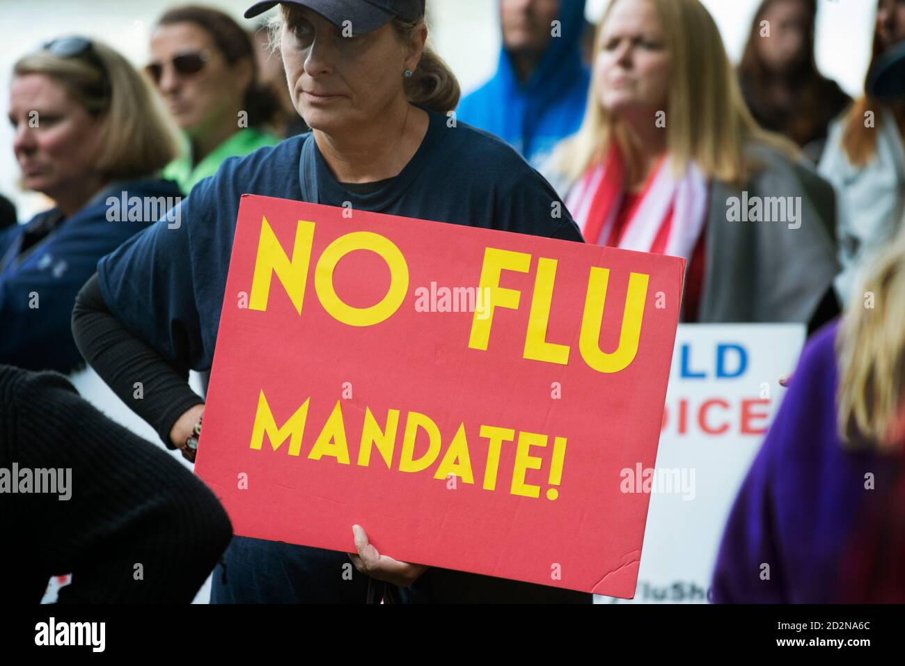 Up to 100 people gathered on October 5th 2020 outside the United States Courthouse in Boston, MA to protest a Massachusetts state law requiring all children attending public school to have been vaccinated against influenza (flu). Stock Photo