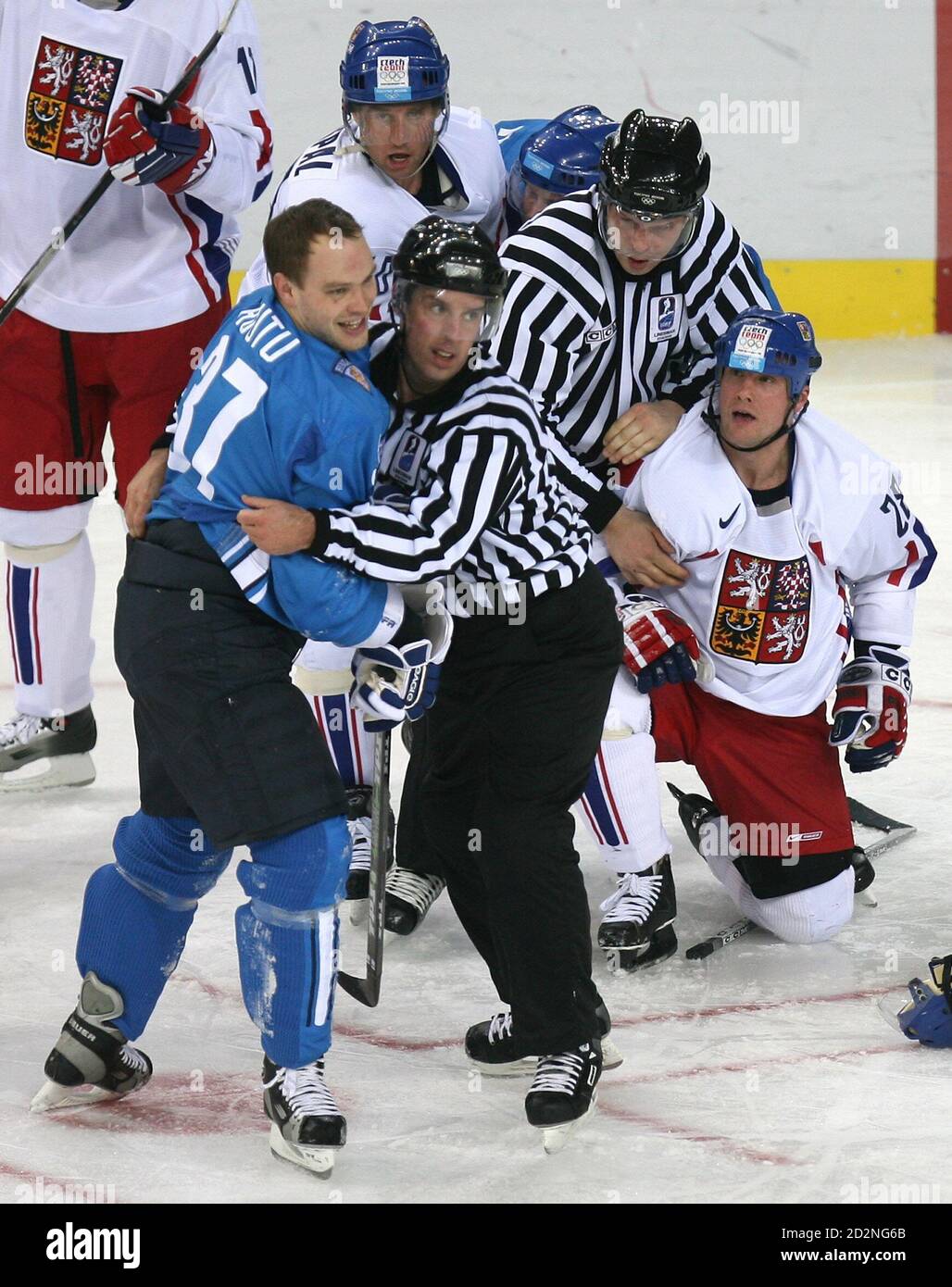 Finland's Jarkko Ruutu (L) is pulled away from Czech Republic's Martin  Straka (R) by a linesman after Ruutu checked hard into the boards Czech  Republic's captain Jaromir Jagr, during second period play