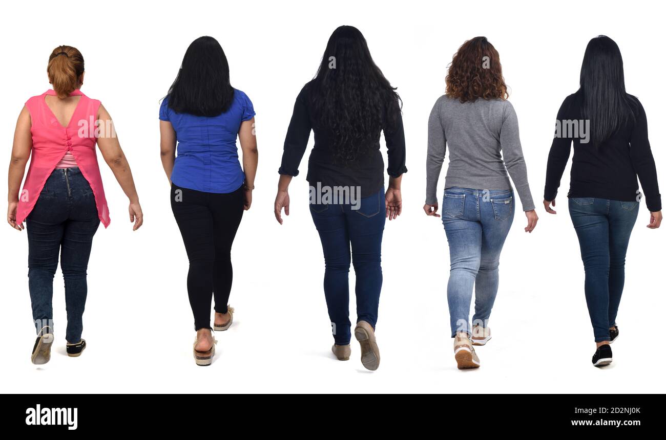 rear view of a group of latin american women walking on white