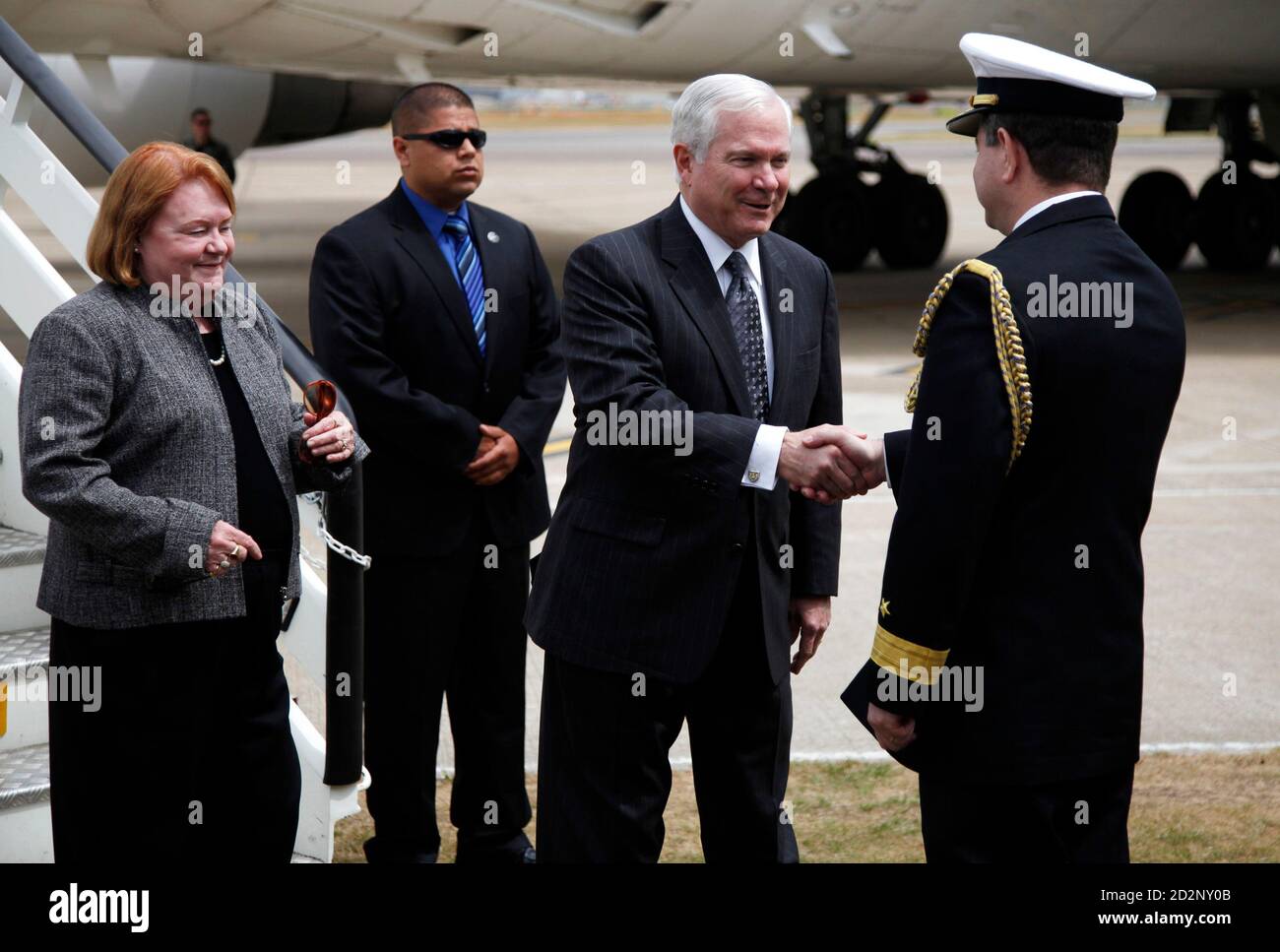 U.S. Defense Secretary Robert Gates (2nd R) and his wife Becky (L