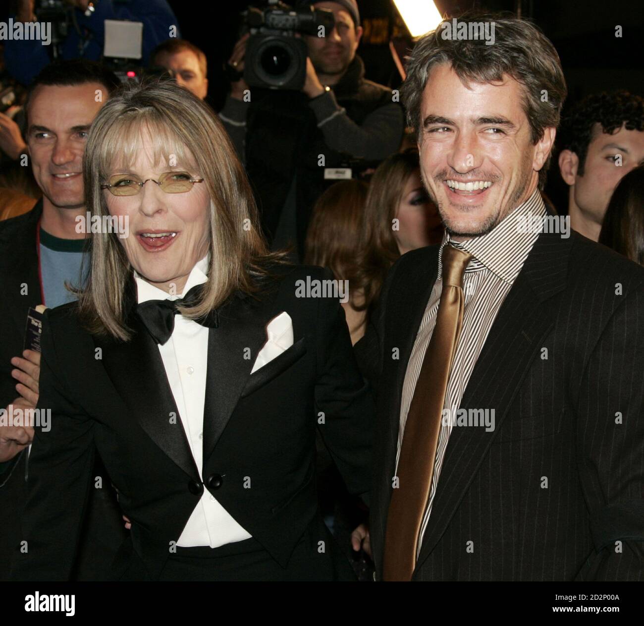 Actress Diane Keaton (L) and actor Dermot Mulroney smile as they arrive at the premiere of their new film 'The Family Stone' in Los Angeles December 6, 2005. [The film, a comic story about the annual holiday gathering of a New England family, also stars Rachel McAdams, Claire Danes, Sarah Jessica Parker and Craig T. Nelson and opens in the U.S. on December 16.] Stock Photo