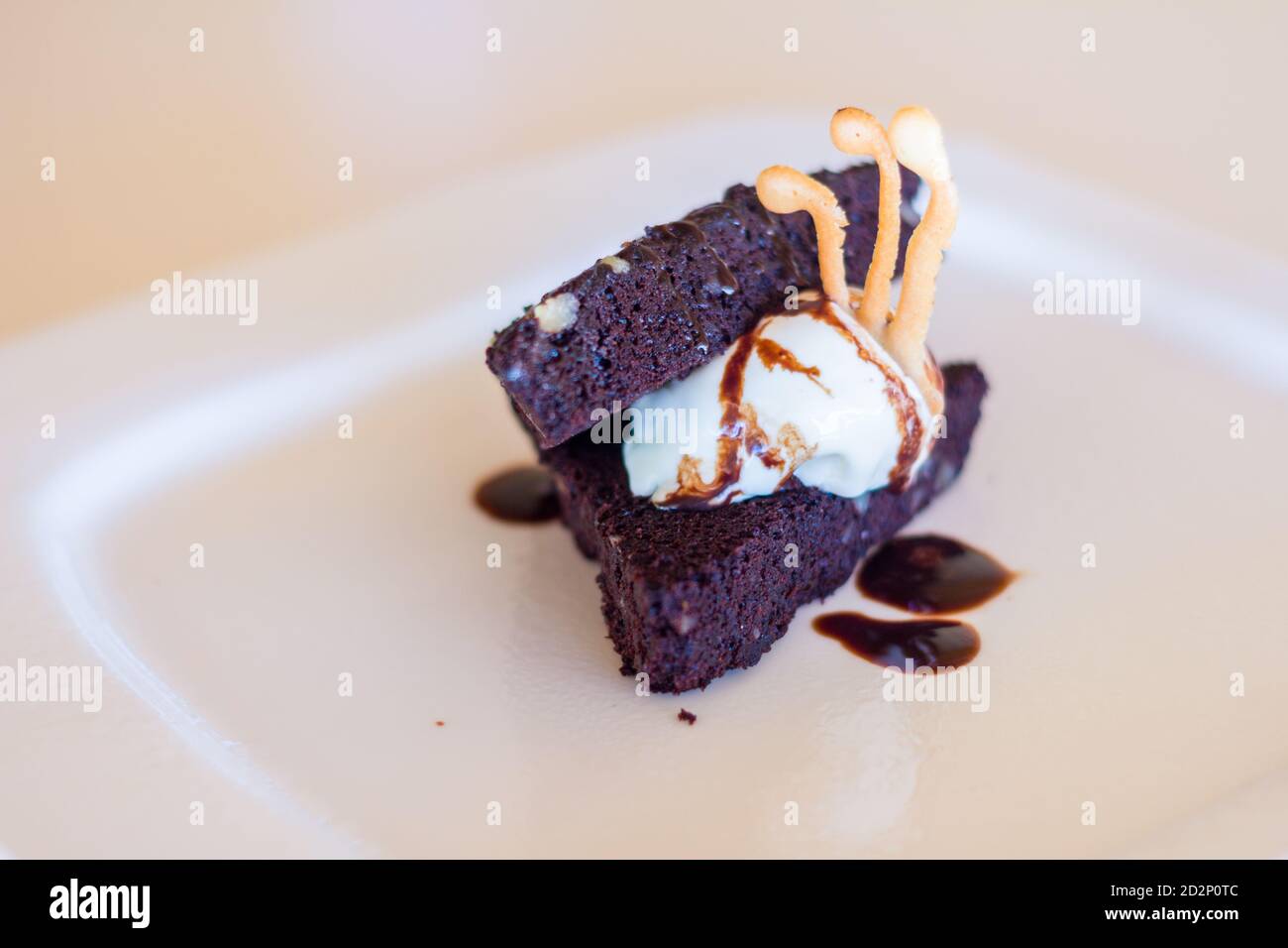 Brownie ala mode with choco syrup Stock Photo Alamy