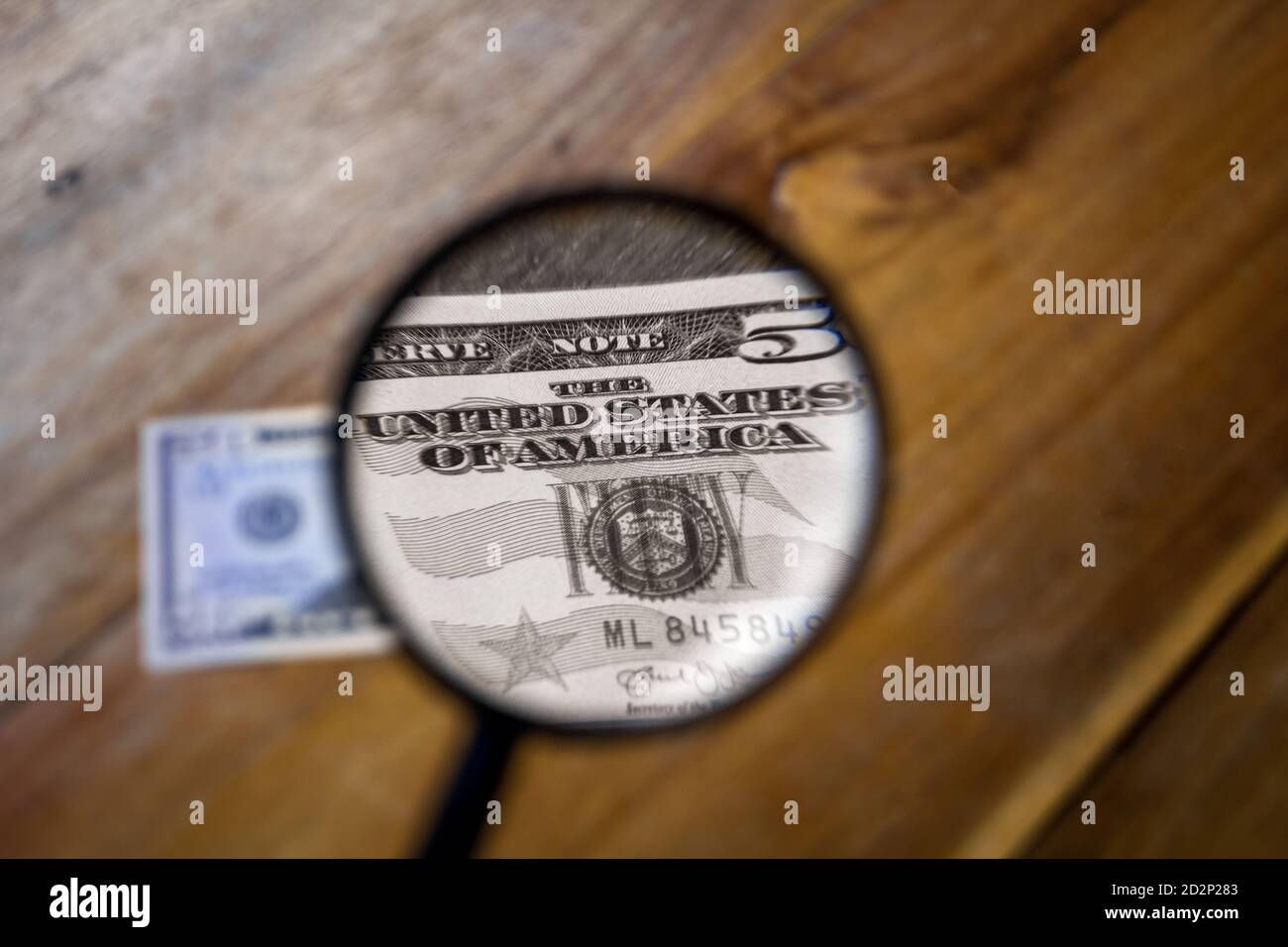 A colorless view through a magnifying glass of the letters, The United ...