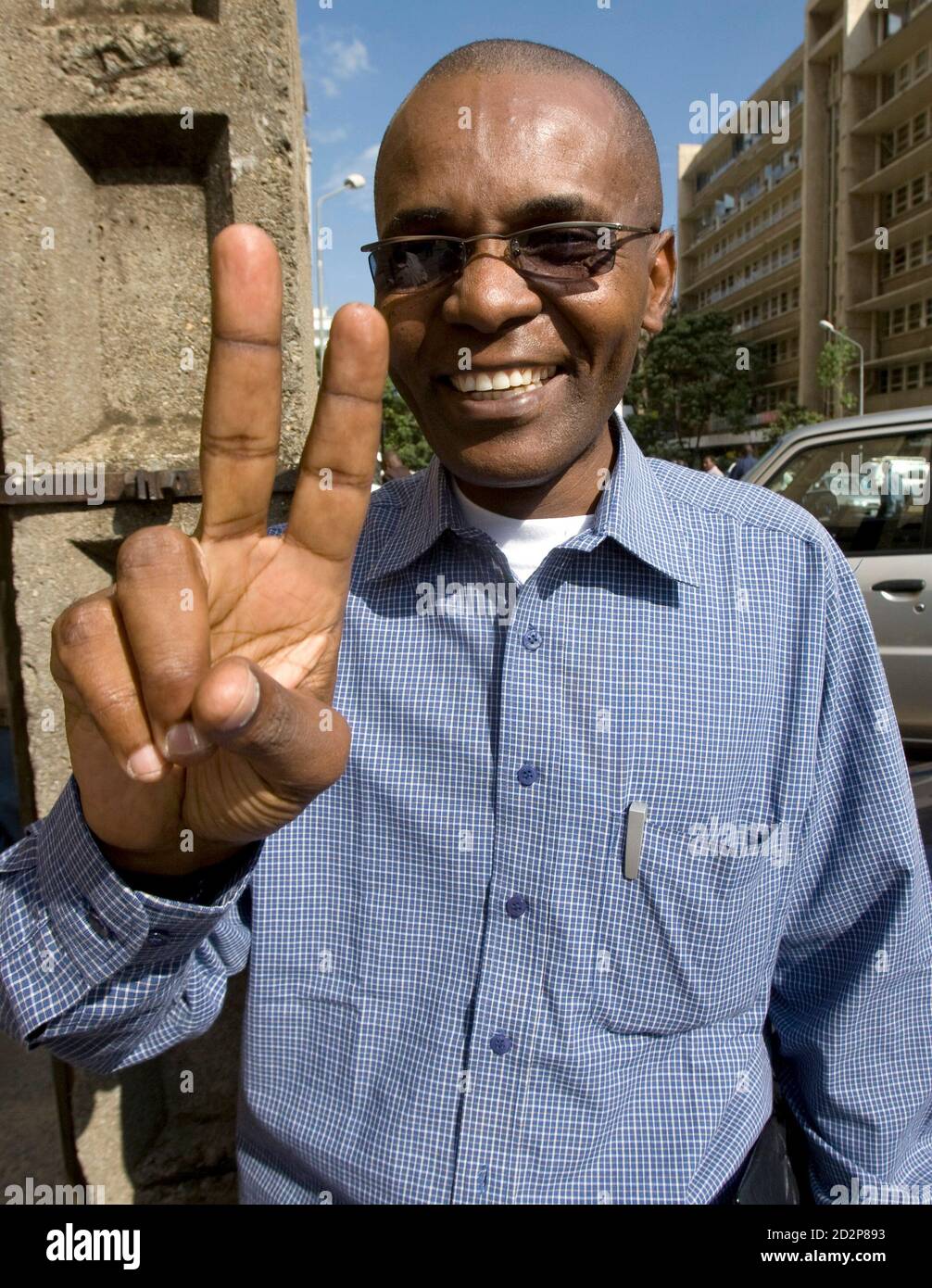 Andrew Mwangura, director of the Mombasa-based East African Seafarers' Assistance Program, gestures to the camera after an interview with Reuters in Kenya's capital Nairobi June 3, 2009. A former seaman, Mwangura breaks news time and time again on seizures and releases of ships by Somali pirates, revealing details of ransom payments in what has become a multimillion dollar business. Picture taken June 3, 2009. To match interview SOMALIA-PIRACY/MWANGURA REUTERS/Thomas Mukoya (KENYA ENTERTAINMENT CRIME LAW) Stock Photo