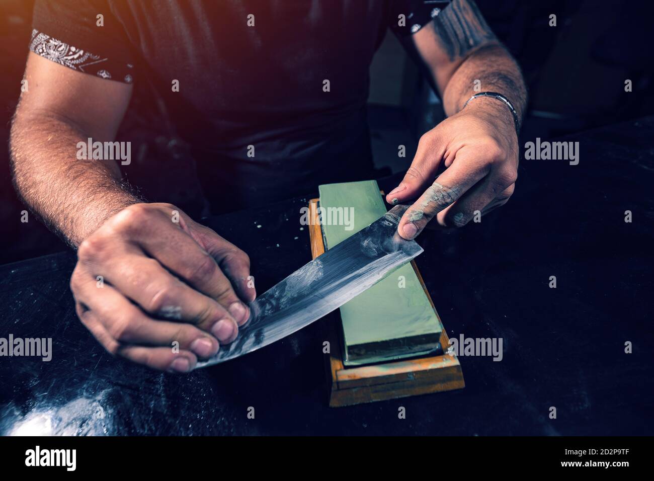 Closeup man hands sharpen knife on whetstone sharpener or grindstone.  Concept, maintenance tools for cooking, make knife sharp ,not dull for long  live using. Original style. 17158382 Stock Photo at Vecteezy