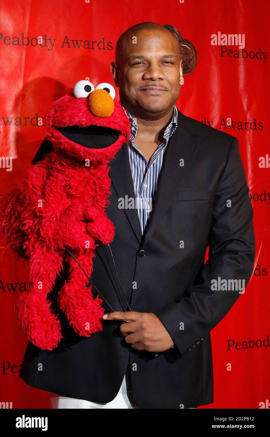 Voice actor Kevin Clash arrives with the Elmo the 2010 Award ceremony at the Astoria in New York May 17, 2010. REUTERS/Lucas Jackson (UNITED STATES - Tags: ENTERTAINMENT