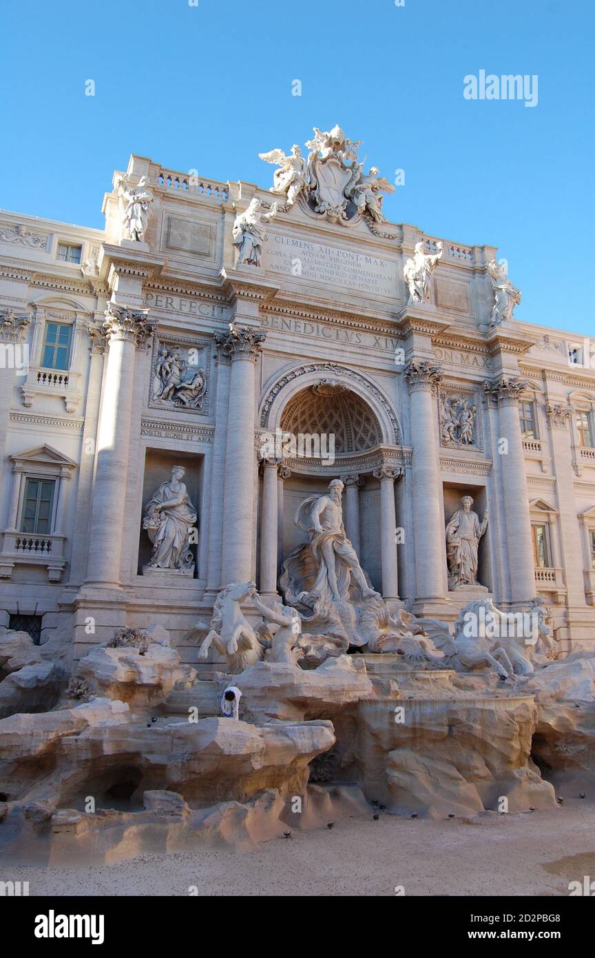 Trevi Fountain in Rome without water inside and blue sky above ...