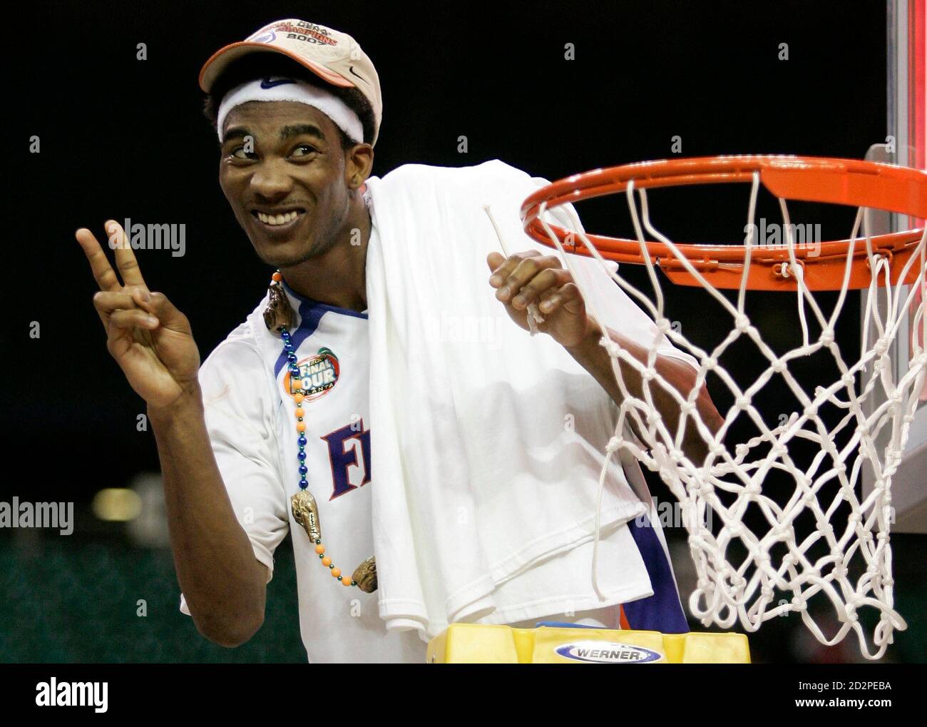 University of Florida Gators' Corey Brewer cuts down the net after his team  defeated the Ohio State Buckeyes in their NCAA Division 1 men's basketball  championship game in Atlanta, Georgia, April 2,