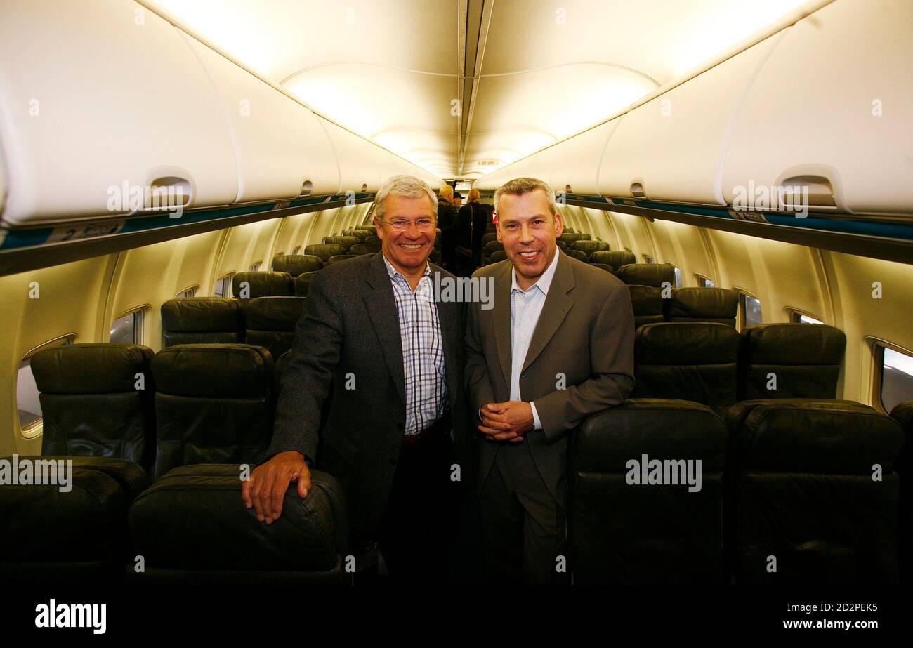 Clive Beddoe (L), chairman and chief executive officer of West Jet, and
