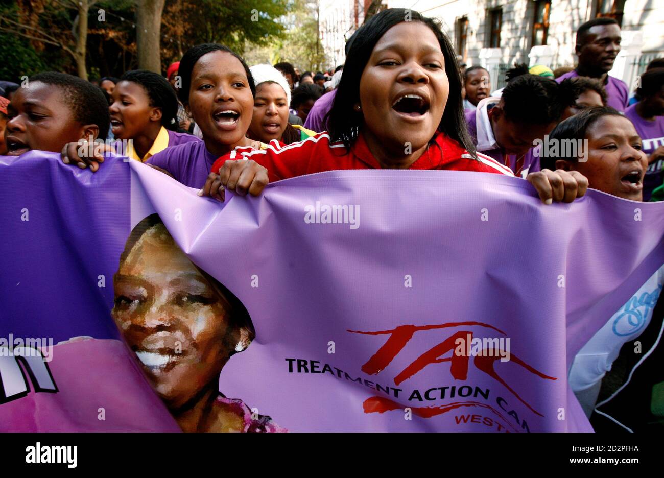 AIDS activists demonstrate in support of axed deputy health minister Nozizwe Madlala-Routledge in Cape Town August 29, 2007. Earlier this month President Thabo Mbeki dismissed Madlala-Routledge, who has won widespread praise for her outspoken approach to tackling AIDS and HIV.  REUTERS/Mike Hutchings (SOUTH AFRICA) Stock Photo