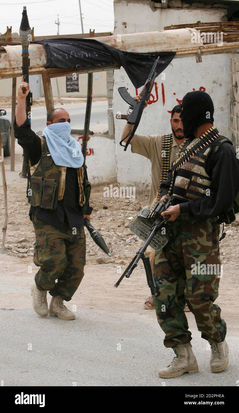 Mehdi Army Fighters Loyal To Cleric Moqtada Al-Sadr Hold Up Their Weapons  As They Chant Slogans In A Street During A Lull In Fighting In Basra, 550  Km (340 Miles) South Of
