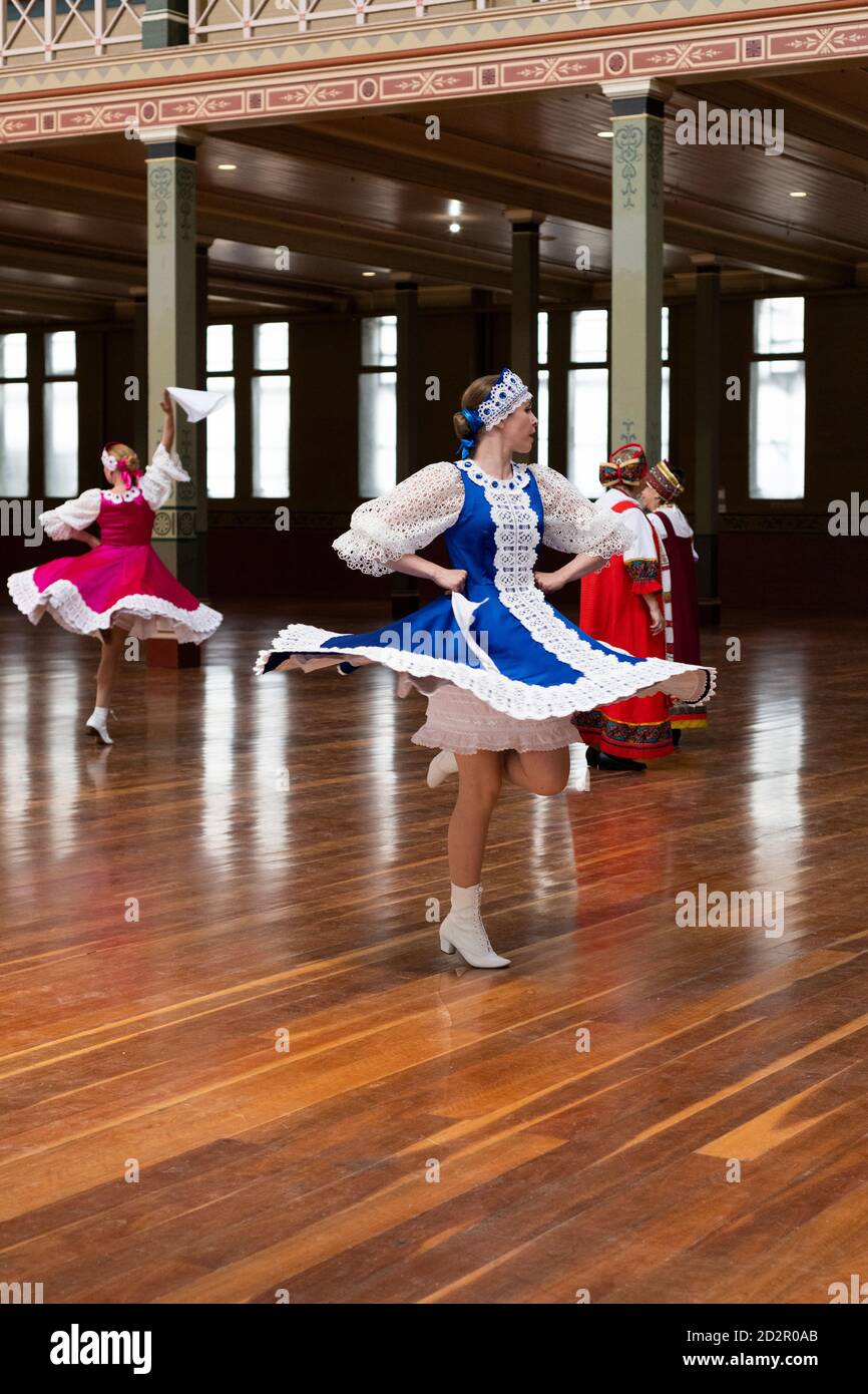 Russian dancers warm up and practice their turns before performing. Stock Photo