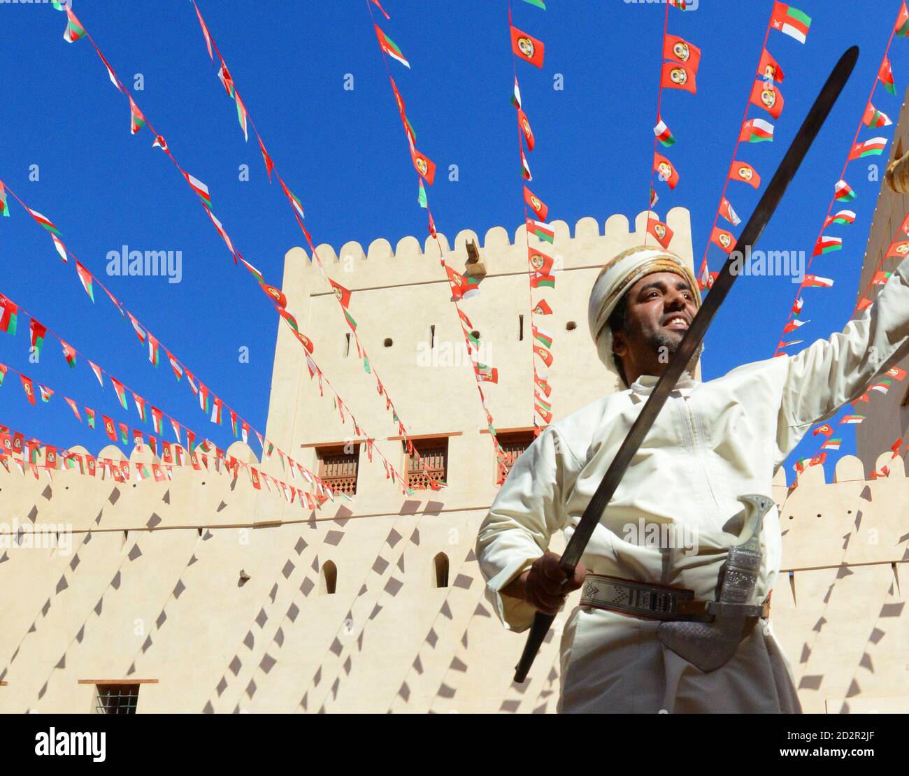 Traditional Omani sword dance in Nizwa fort, Oman. Stock Photo