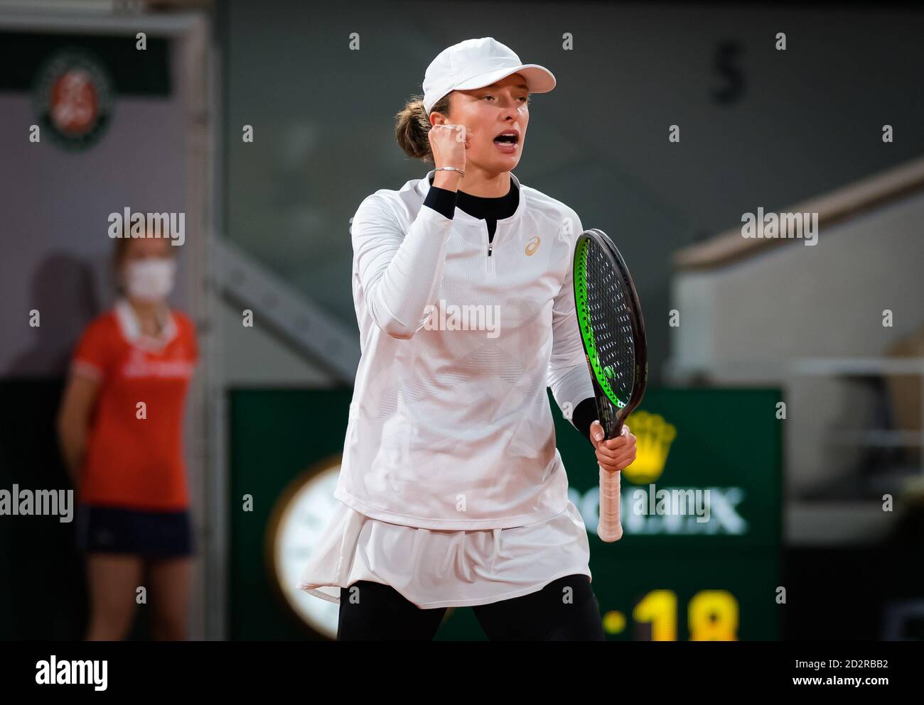 ga Swiatek of Poland in action against Martina Trevisan of Italy during the quarter-final of the Roland Garros 2020, Grand Slam tennis tournament, on Stock Photo