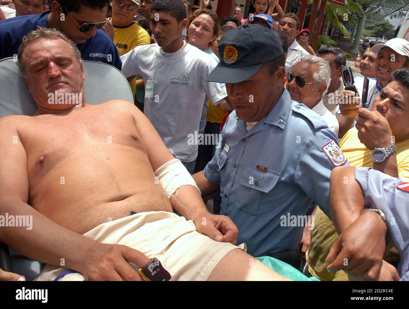 Slovenian marathon swimmer Martin Strel, 52, receives first aid from  Brazilian medics after swimming into the Amazon port city of Belem, at the  river's mouth, April 8, 2007, 67 days after beginning